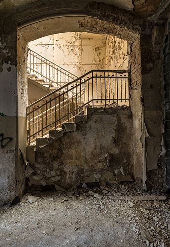 Stairs in abandoned and dilapidated building by Inge van den Brande