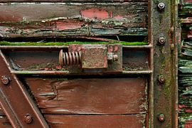 Spring as a stop to catch sliding door of old train wagon by Jenco van Zalk