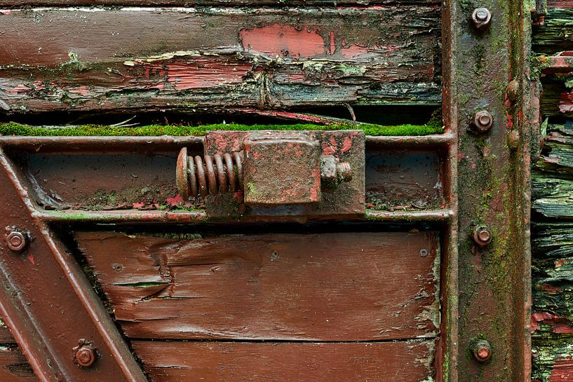 Spring as a stop to catch sliding door of old train wagon by Jenco van Zalk