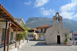 Old stone church in the village square of Areopoli by Tomherkules