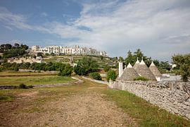 View of Ostuni with Trulli farm in foreground, Italy