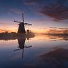 Reflections during sunrise in Kinderdijk by Raoul Baart