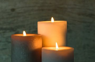 Festive burning candles in the dark by Alex Winter