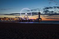 Pier Scheveningen with illuminated Ferris wheel from the beach