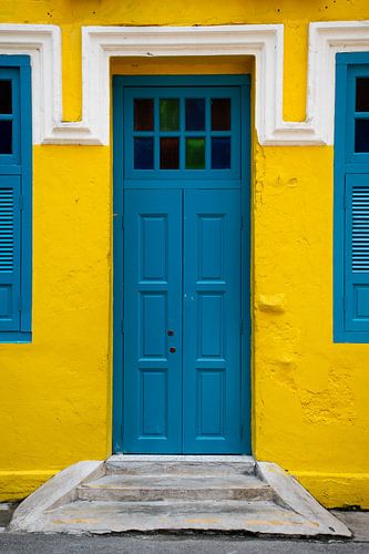Yellow wall with a blue door in Kuala Lumpur