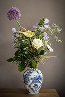 Still life picking bouquet of flowers in delft blue vase