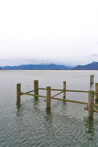 Remains of an old landing stage for boats on Lake Chiemsee by Heiko Kueverling