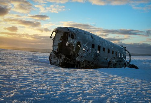 Plane wrecked on beach Iceland sunrise