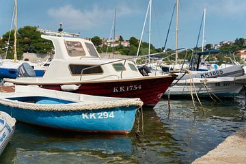 Boats in the port of the town of Krk in Croatia by Heiko Kueverling