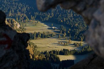 Autumn in the Ammergau Alps. Sunrise. Through the window at the Hochplatte