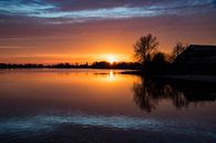 Zonsondergang over water bij Earnewâld van Tilja Jansma thumbnail