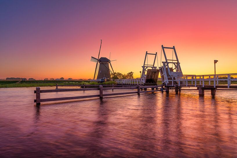 Sunset with mill and bridge by Björn van den Berg