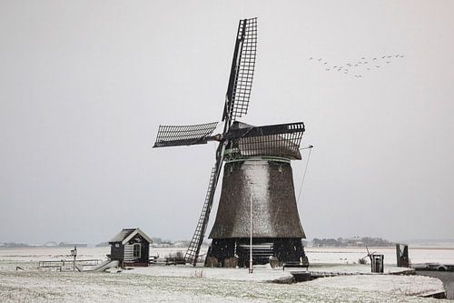 Dutch windmill in a winter landscape