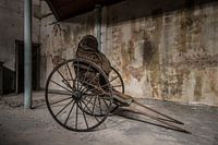 In a carriage...