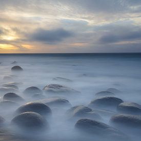 Floating stones on the beach (Lofoten, Norway) by Paul Roholl