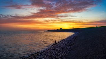 Den Helder and the dike at sunrise by eric van der eijk