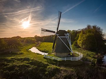 Windmill and sun by Hans Langenberg