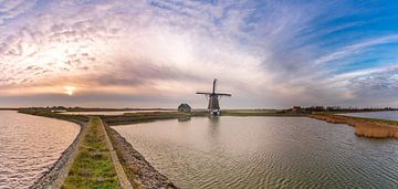 Moulinez le panorama du coucher de soleil de Texel Nord