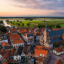 Sunset hattem with zwolle and the IJssel in the background by Thomas Bartelds