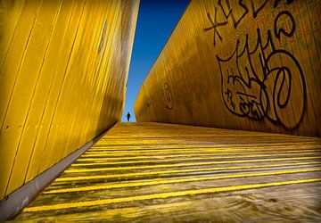 Yellow stairs with man by Marcel van Balken