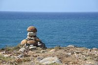 Little stone man by the sea