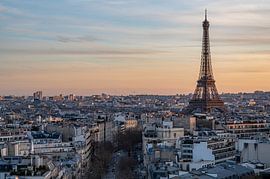 The Eiffel Tower rising above the rooftops of Paris by Karsten Rahn