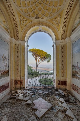 View into abandoned villa during sunset