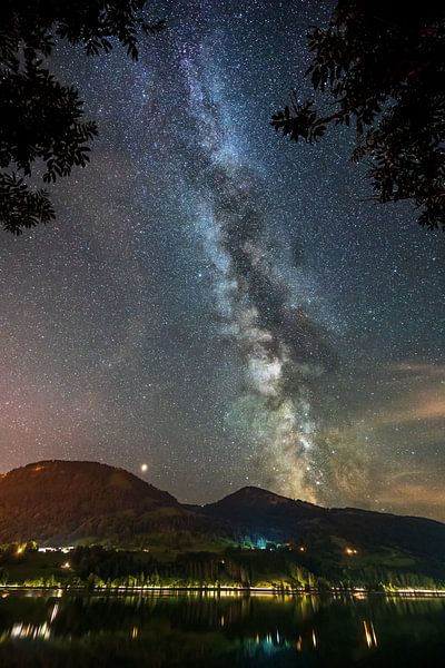Milky way and night sky in Immenstadt im allgäu above the large Alpsee lake by Daniel Pahmeier