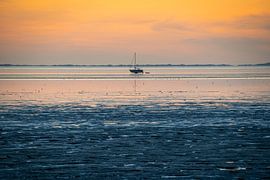 Sailing boat on the mudflats by Joep Henkelman