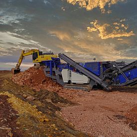 Stone crusher and excavator in action by Babetts Bildergalerie