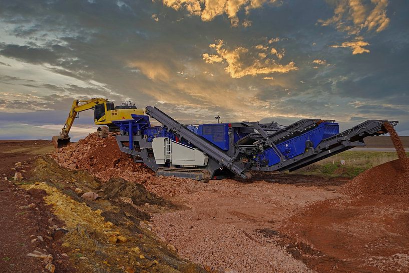 Stone crusher and excavator in action by Babetts Bildergalerie