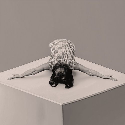 A dancer bowing with her arms wide open.