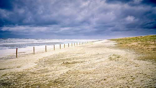 Storm along the coast with dunes, beach and the North Sea