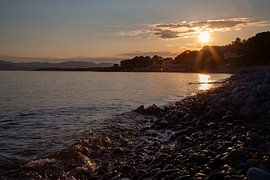 Zonsondergang aan Plage du debarquement du Dramont van Kim Hoozemans