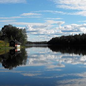 Immeljarvi lake near Levi with nice reflections on the water surface by Jutta Klassen