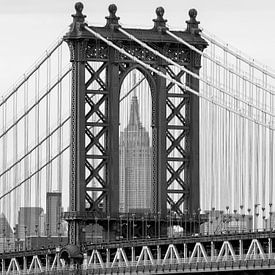 View of the Empire State Building framed by the Manhattan Bridge by Carlos Charlez