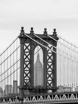 View of the Empire State Building framed by the Manhattan Bridge