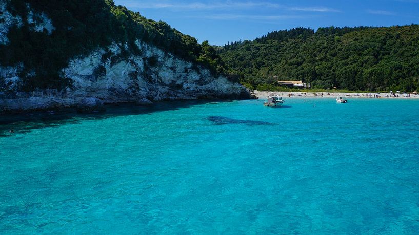 Sailing ships on paradise like turquoise water of greek island corfu bay in summer by adventure-photos