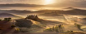 Wide Tuscany landscape with fog at sunrise