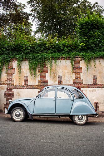 Blue Citroën 2CV on French streets - classic car with charm