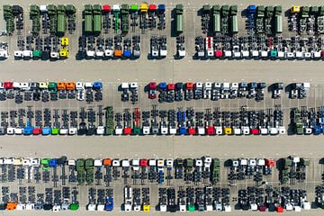 Trucks in a row at a parking lot seen from above