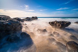 Long exposure on rocky beach by Christian Klös