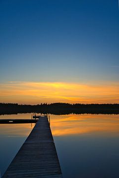 Jetty that reaches into a Swedish lake by Martin Köbsch