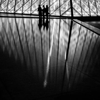 The Louvre pyramid at night.