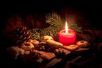 Candle stands between Christmas cookies