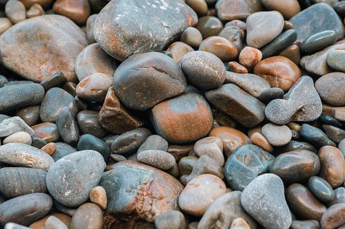 Blue/grey pebbles by the sea by Truus Nijland