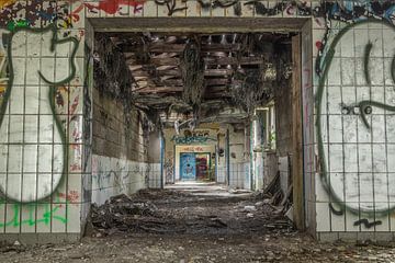 Urbex corridor with lots of graffiti by Sasja van der Grinten