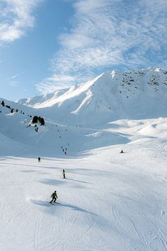 Skiers on the slopes in the Alps - Winter sports by Marit Hilarius