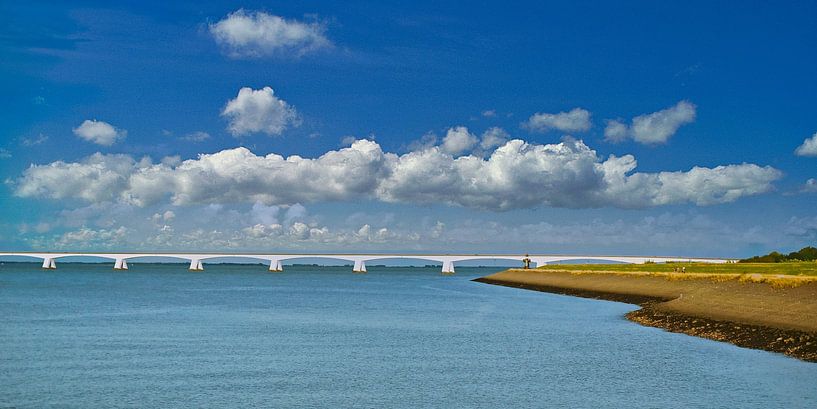 Clear blue sky with clouds above the Zeelandbrug by Gert van Santen