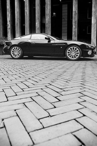Aston Martin Vanquish sports car parked in front of a modern design shop by Sjoerd van der Wal Photography
